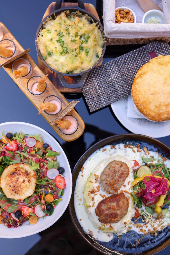 A table with plates of food and drinks